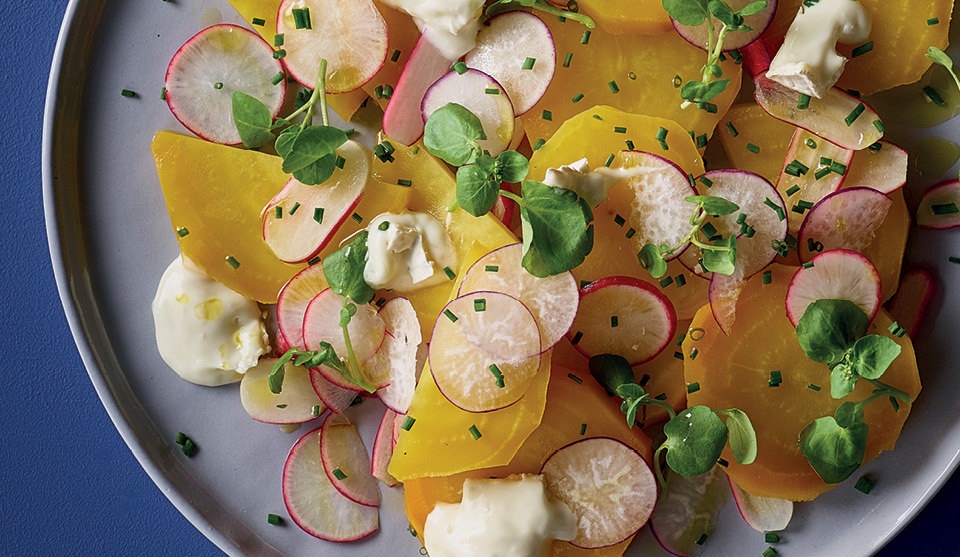 Roasted Golden Beetroot, Watercress and Goats Cheese Salad served on a grey plate and topped with chives